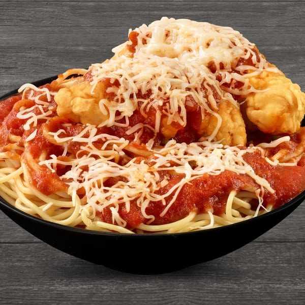 Brown's Chicken spaghetti with marinara sauce, fried chicken pieces, and shredded cheese in a black bowl.