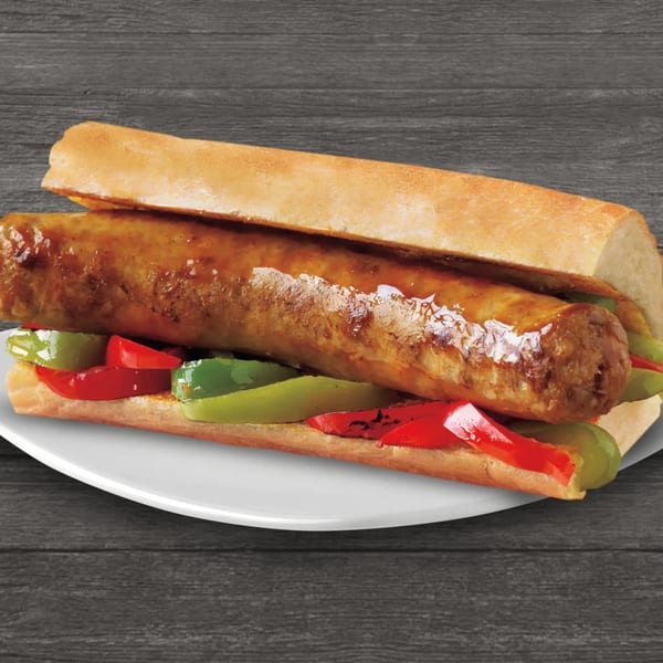 Brown's Chicken Italian sausage sandwich with red and green peppers on a white plate.